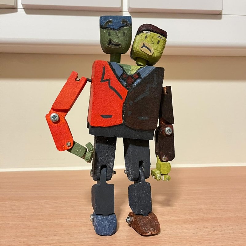 A 3D wooden puppet with two heads